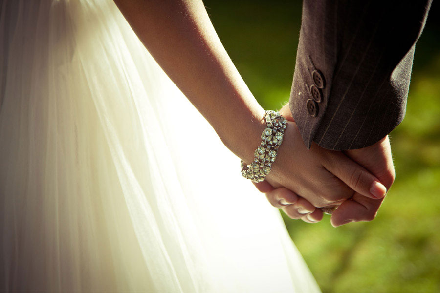 Bride & Groom holding hands